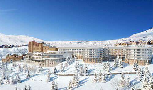 Club Med Alpe d'Huez in lovely blue sky and mountain landscape