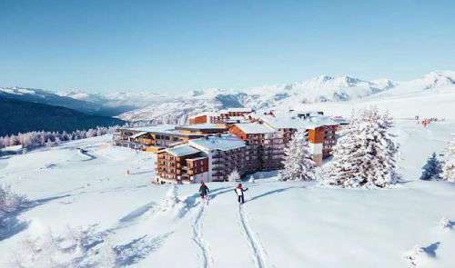 Aerial shot of Club Med La Rosiere in lovely blue sky and mountain landscape