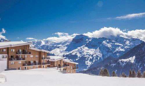 View of Club Med Samoens with dramatic mountain backdrop behind