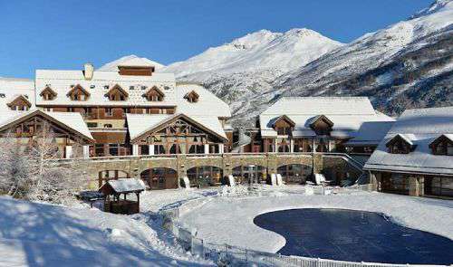 Front of Club Med Serre Chevalier with mountain backdrop