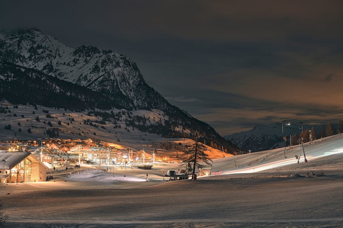 Ski resort of Montgenèvre illuminated at night with mountain backdrop