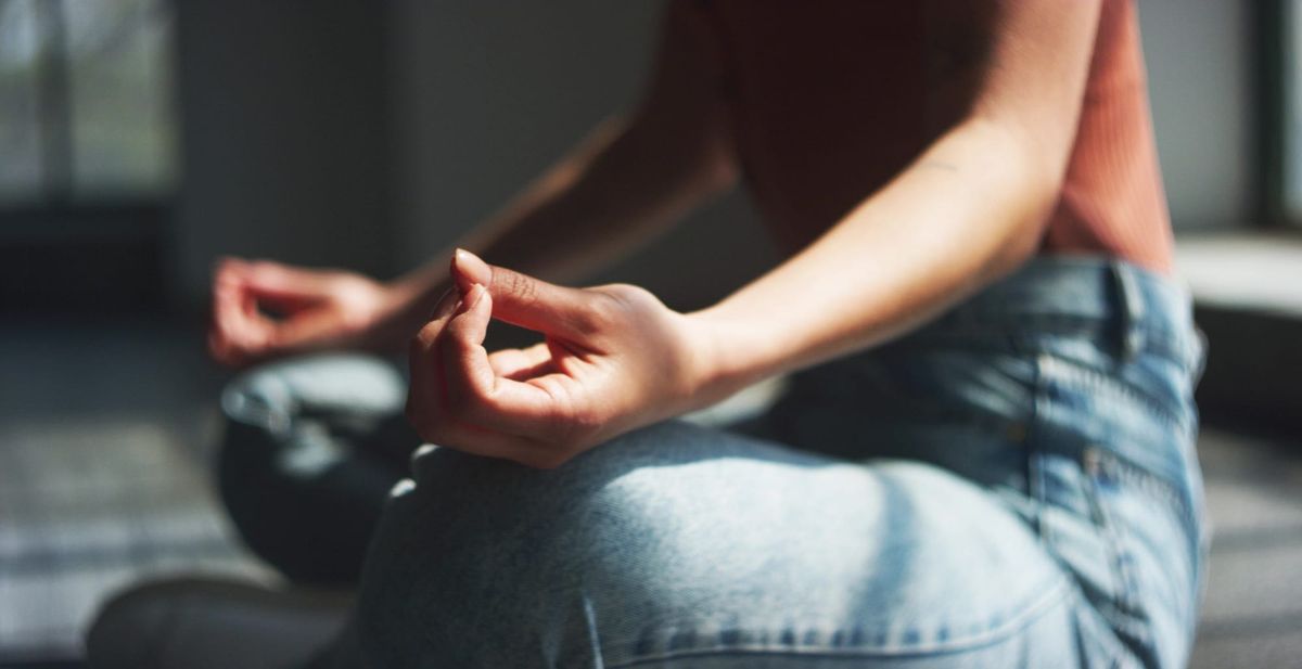 woman meditating, natural remedies for daily stress relief.