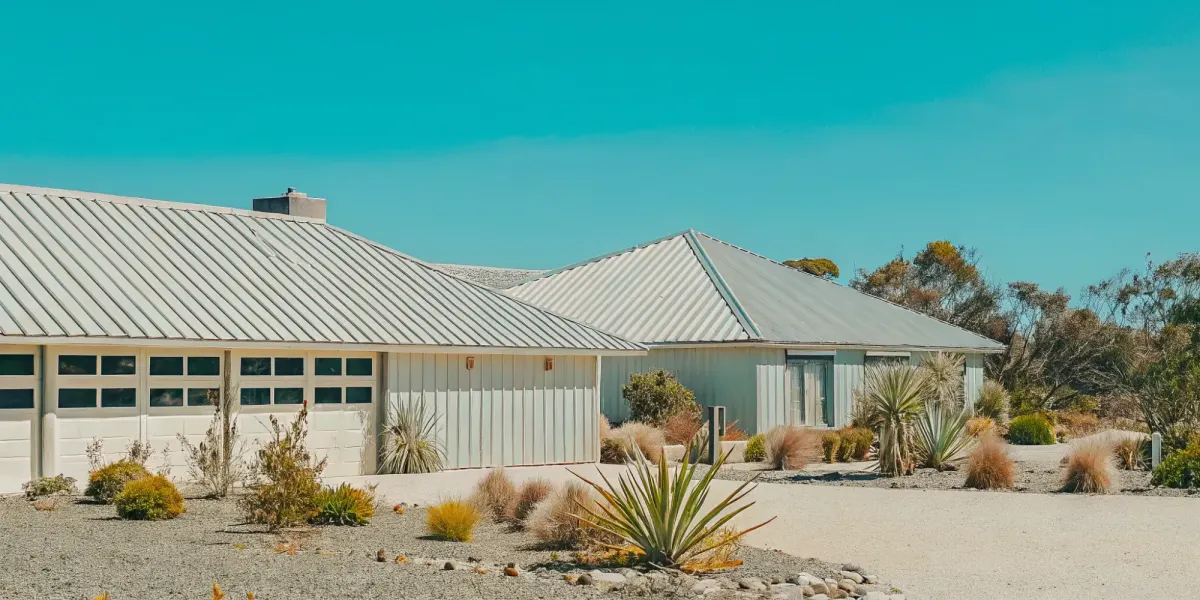 Wildfire-resistant home with metal roof and defensible space.