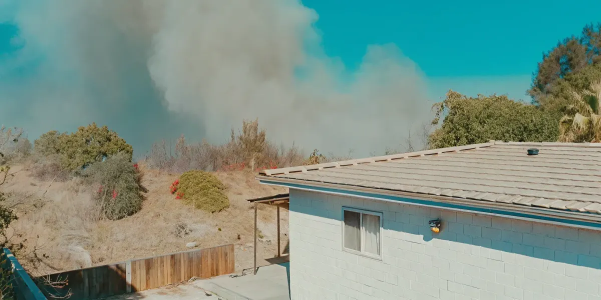A home's common ignition points, like its roof and vents, are at risk from a nearby wildfire.