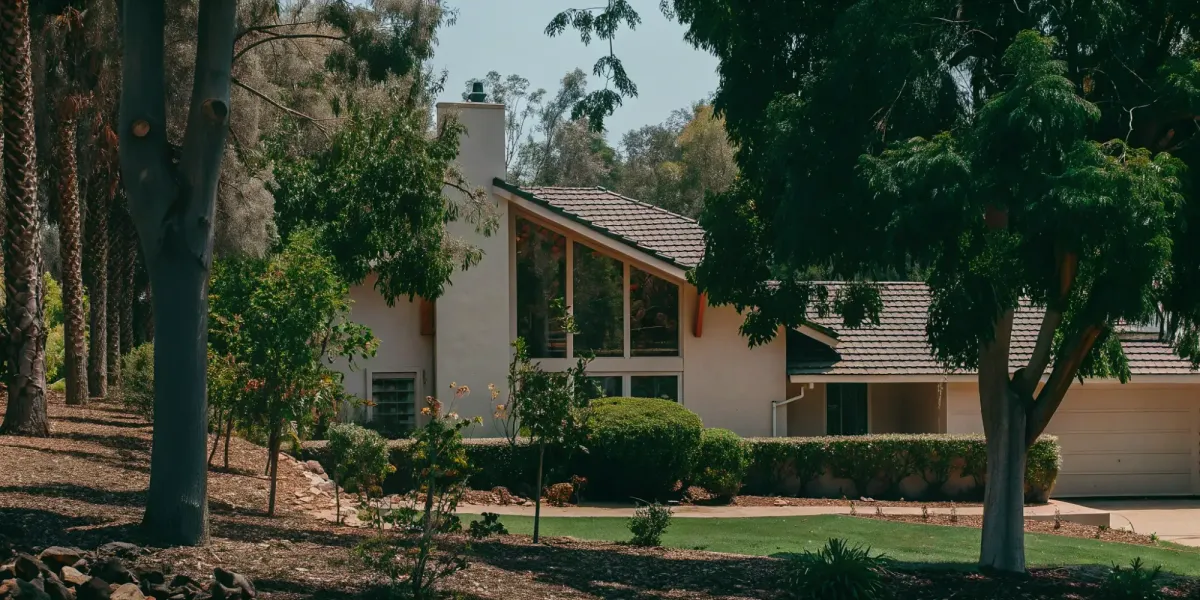 A fire-hardened home with clear defensible space, following a fire hardening checklist.