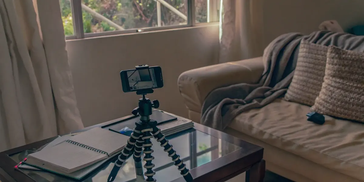 Creating a video home inventory for insurance by filming a living room with a smartphone.
