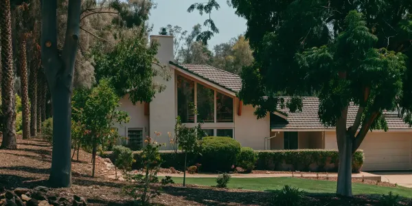 A fire-hardened home with clear defensible space, following a fire hardening checklist.