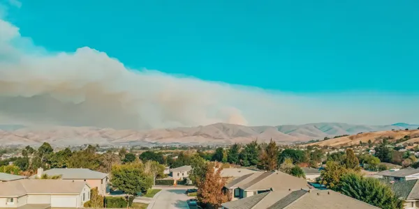 A wildfire risk map showing specific risk levels by address for homes located near a dry hillside.