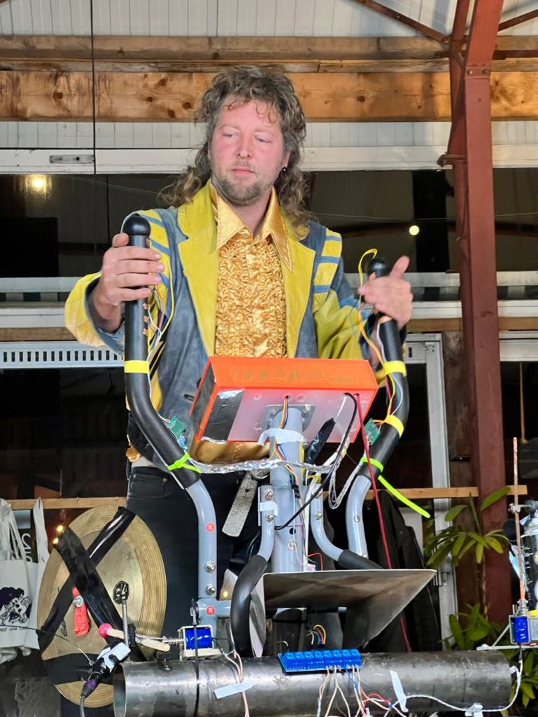 A man. A mullet. Soldered together technology.