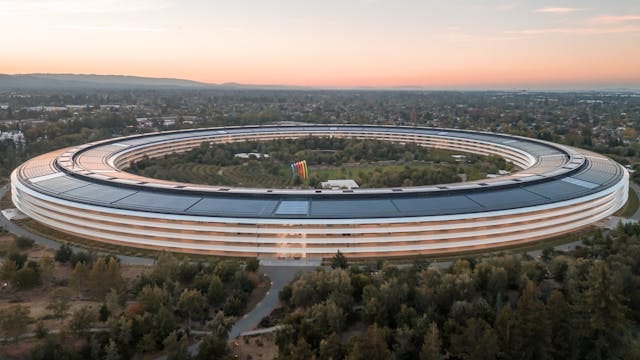 An aerial shot of Apple Park in Cupertino, California, at dusk.