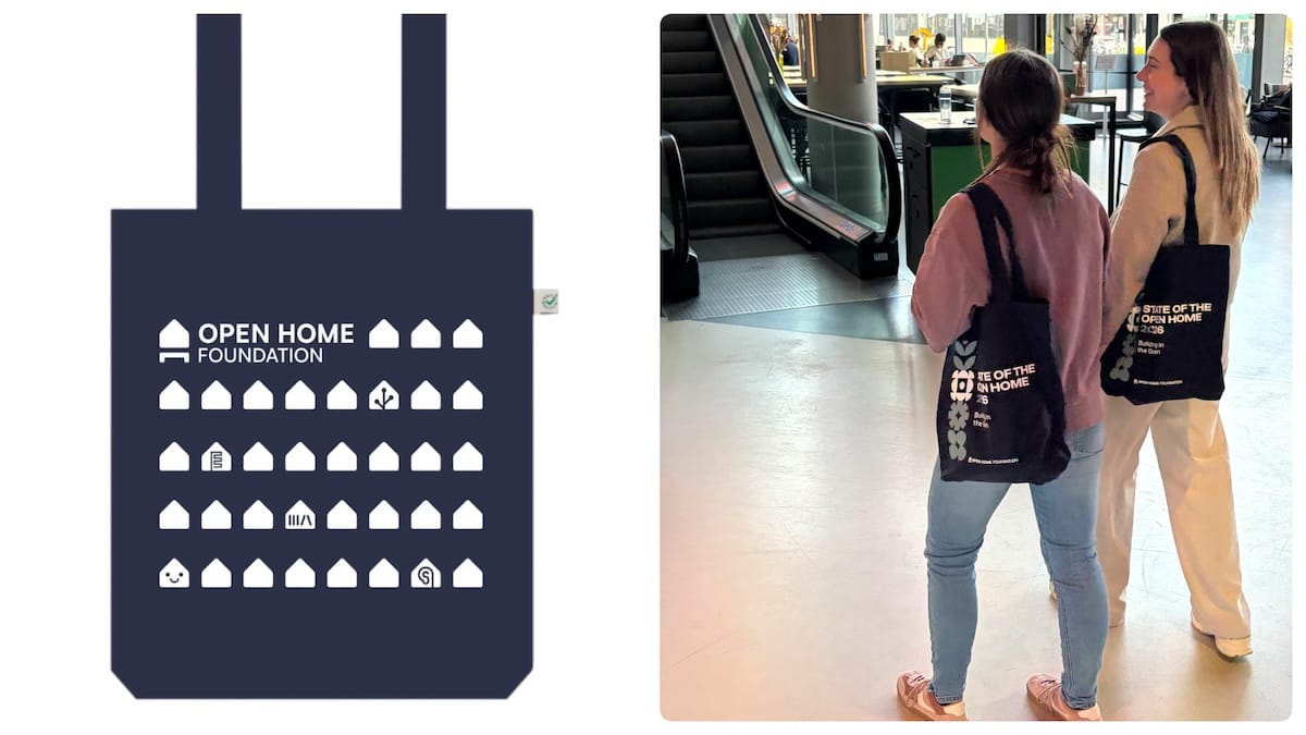 A cutout of an Open Home Foundation tote bag and two people carrying similar totes.