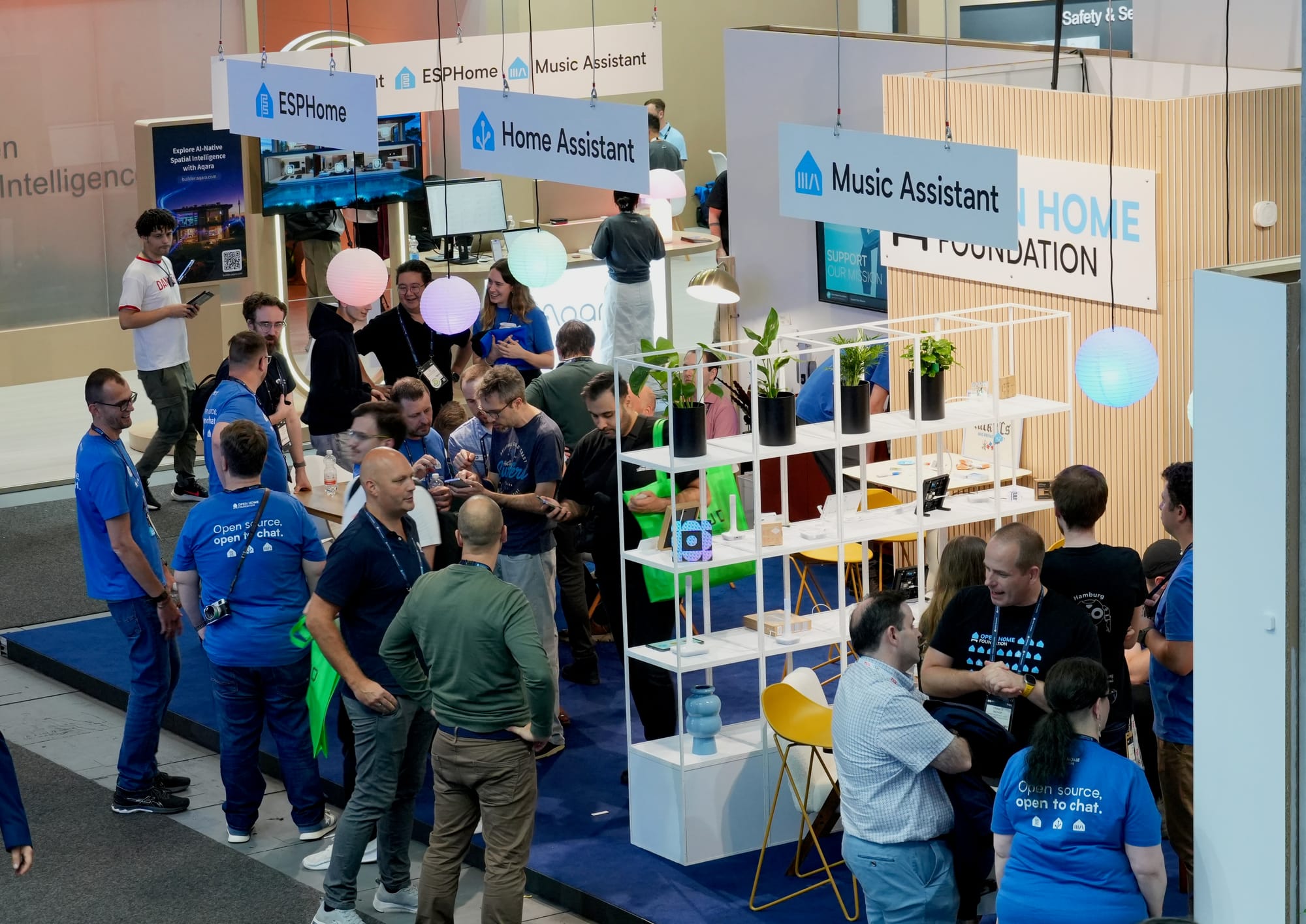 A long shot of the Open Home Foundation booth at IFA Berlin busy with staff and visitors.