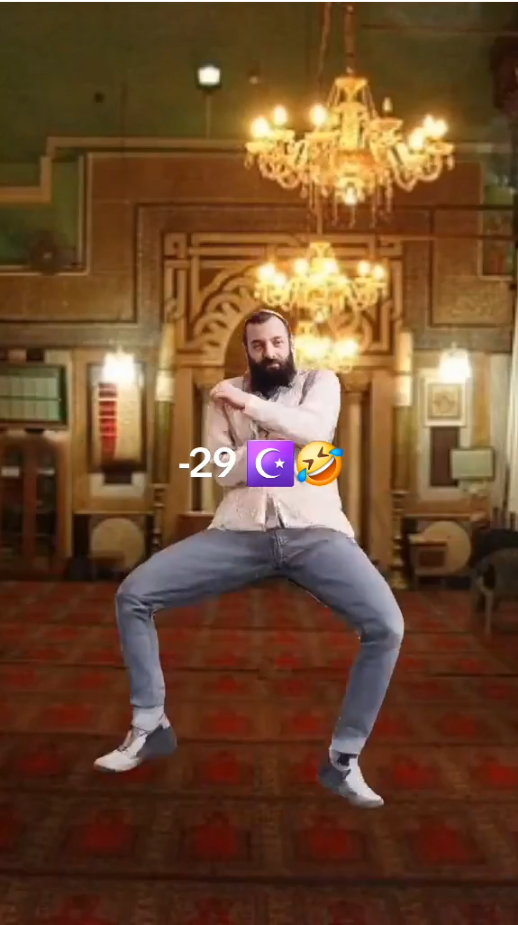 Poorly cropped dancing man in front of an AI generated place resembling a colourful Mosque. Text in front reads "-29 [Star and Crescent] [laughing face]."