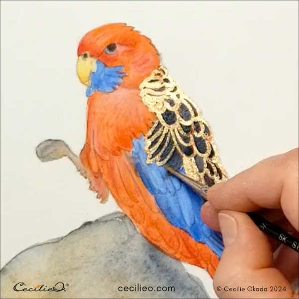 Decorating the parrot with watercolor gold.