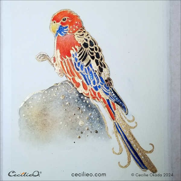 The completed red parrot watercolor decorated with gold paint.