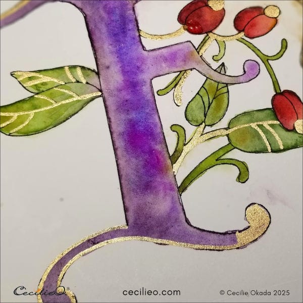 More gold paint on the letter design.