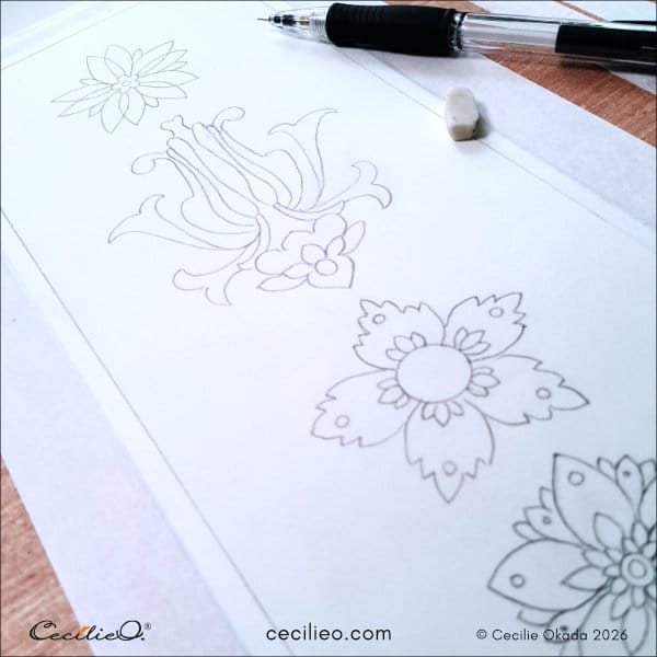 Drawing ornamental shapes to paint with watercolor, using inspiration from color swatches.