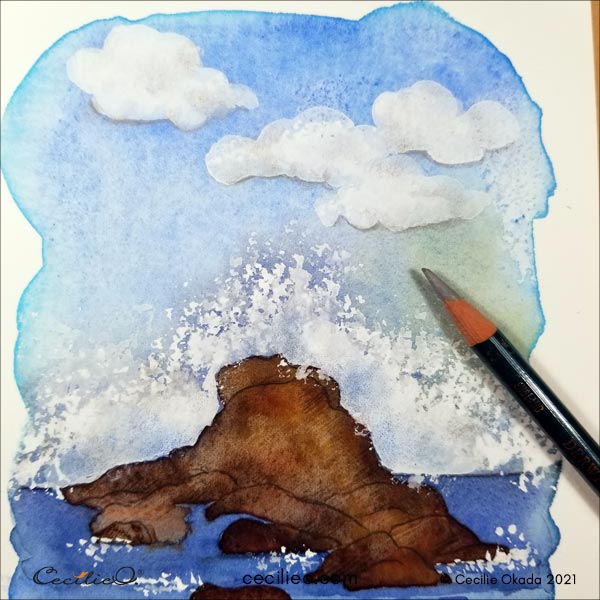 Drawing shadows under the clouds with a grey colored pencil. 