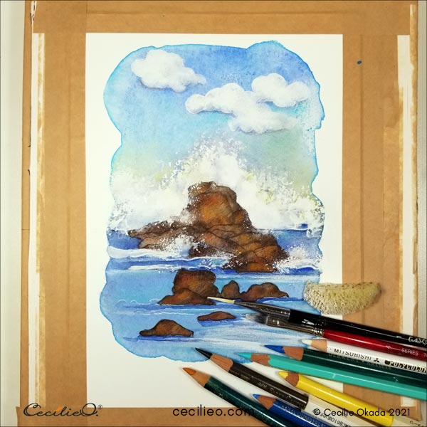With a variety of colored pencils, as well as more than one brush for the white gouache, entering the creative process.