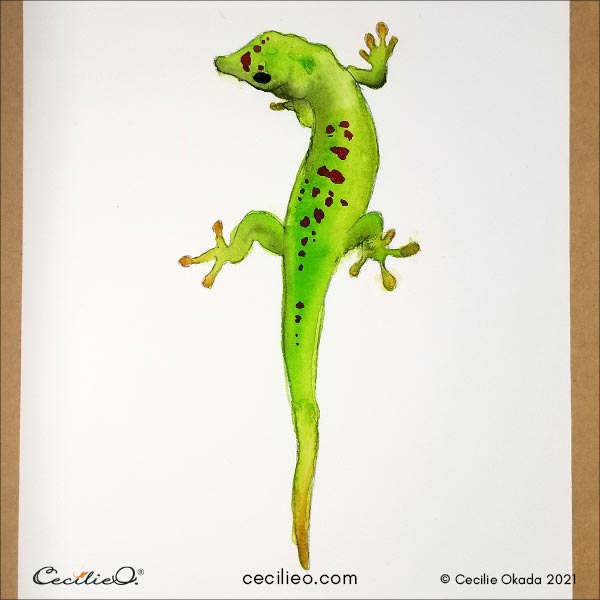 Painting the red spots on the gecko's back.