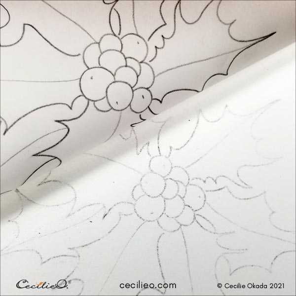 The image of the holly has been transferred to watercolor paper.