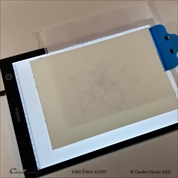 Getting ready to trace the outline on a LED light tracing pad.