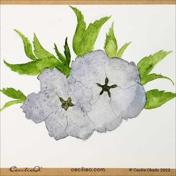 Painting the green leaves and flower center.