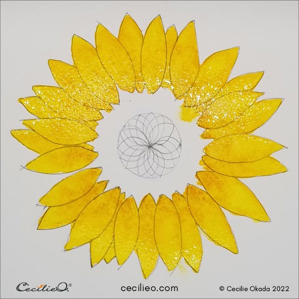 Painting the sunflower petals yellow.