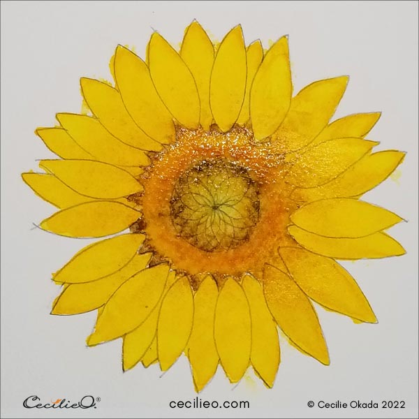 Adding the darker colors to the sunflower center with watercolor. 