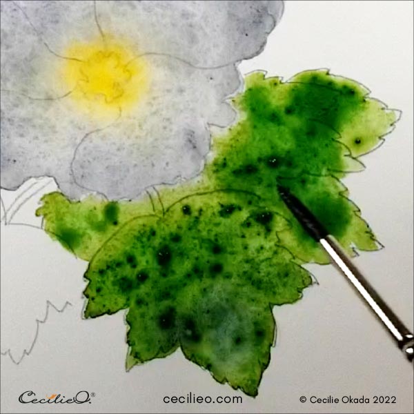 Painting the leaves with various green watercolors.