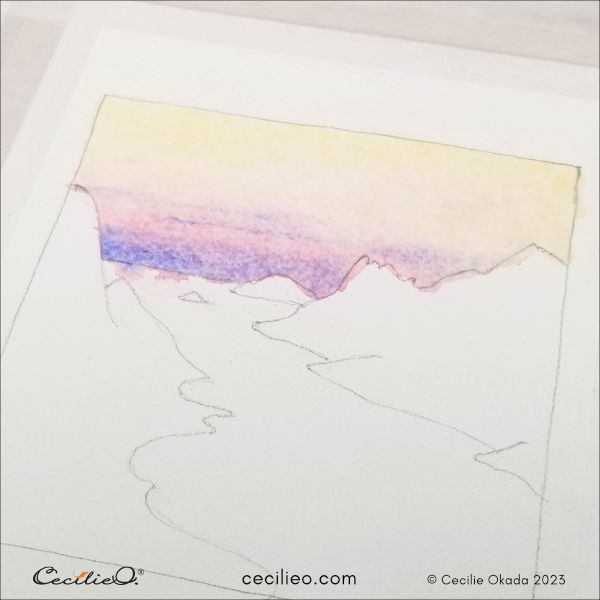 Add blue to the watercolor sunrise sky.