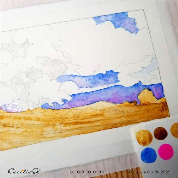 I painted the sky with blue and pink watercolor.