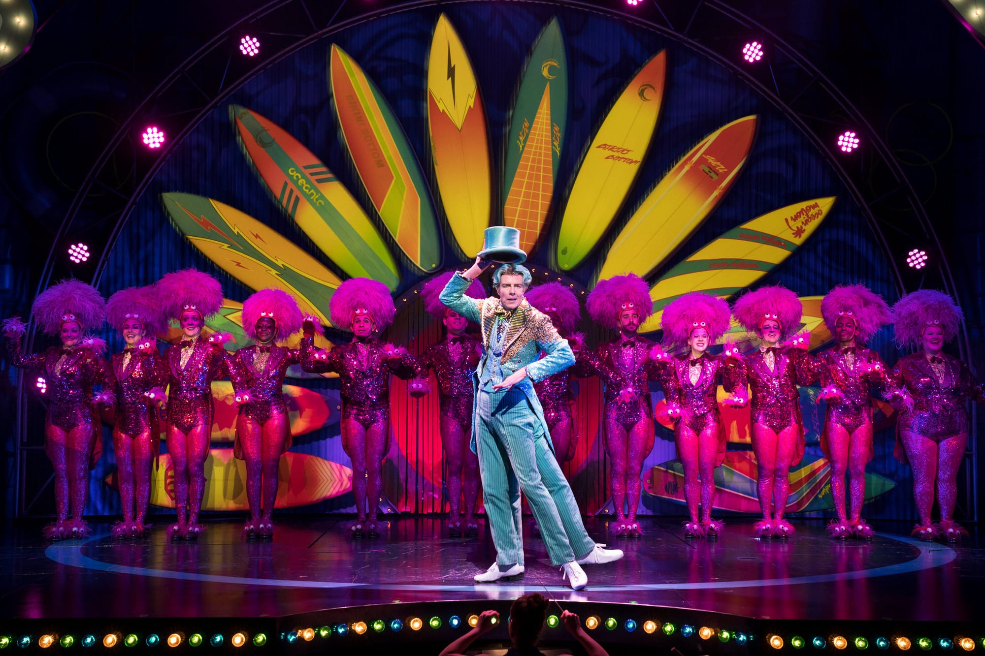 Gavin Lee performing as Squidward in SpongeBob the Musical on Broadway. He appears to have four legs and is performing a tap dance.