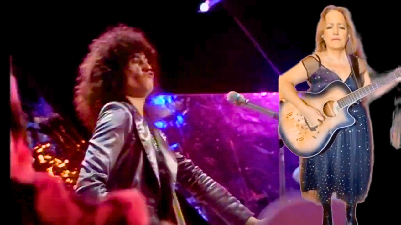 An image from my Bang a Gong video. A video of me playing my acoustic guitar and wearing a party dress, superimposed on T. Rex playing the song.