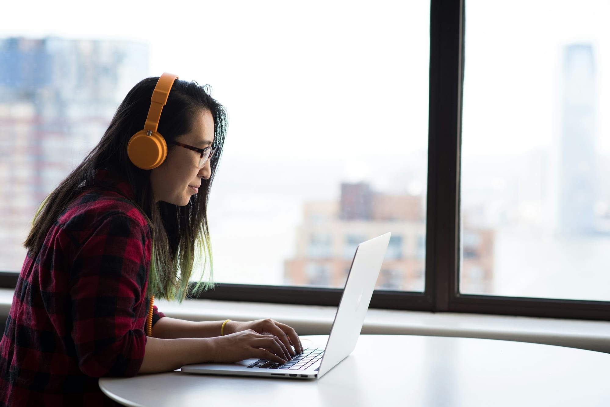 woman using headphones - Best Email Parser