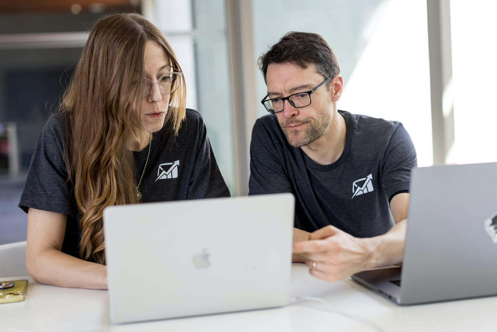 employees on a laptop - How to Automatically Move Emails to a Folder in Gmail