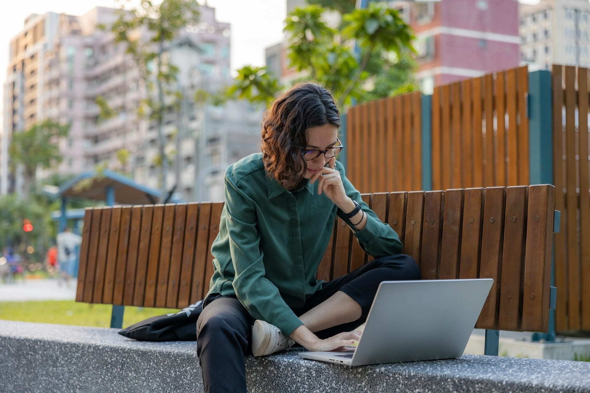 woman sitting on a bench - How to Declutter Email
