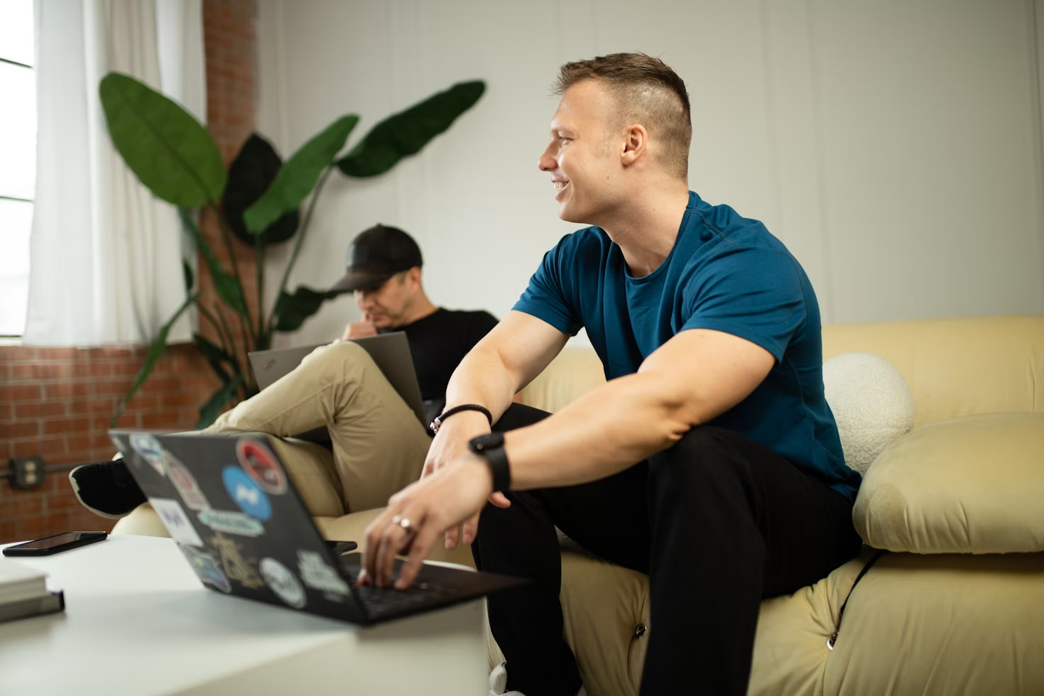 man sitting on a couch - Obsidian vs Notion