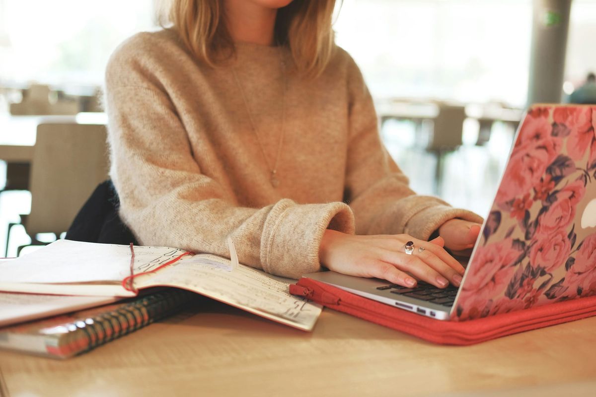 woman typing on a laptop - Automate Email Responses