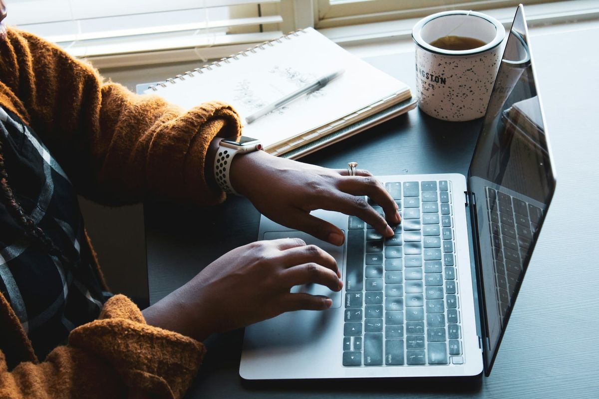 woman typing on a laptop - Inbox Zero Method