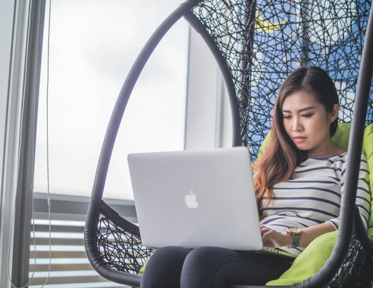 woman on a laptop - What is an Email Client 