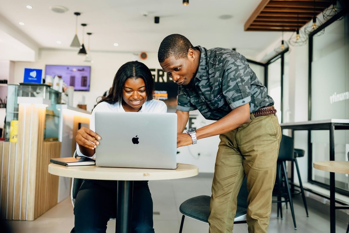 man and woman on a laptop - Email Overload