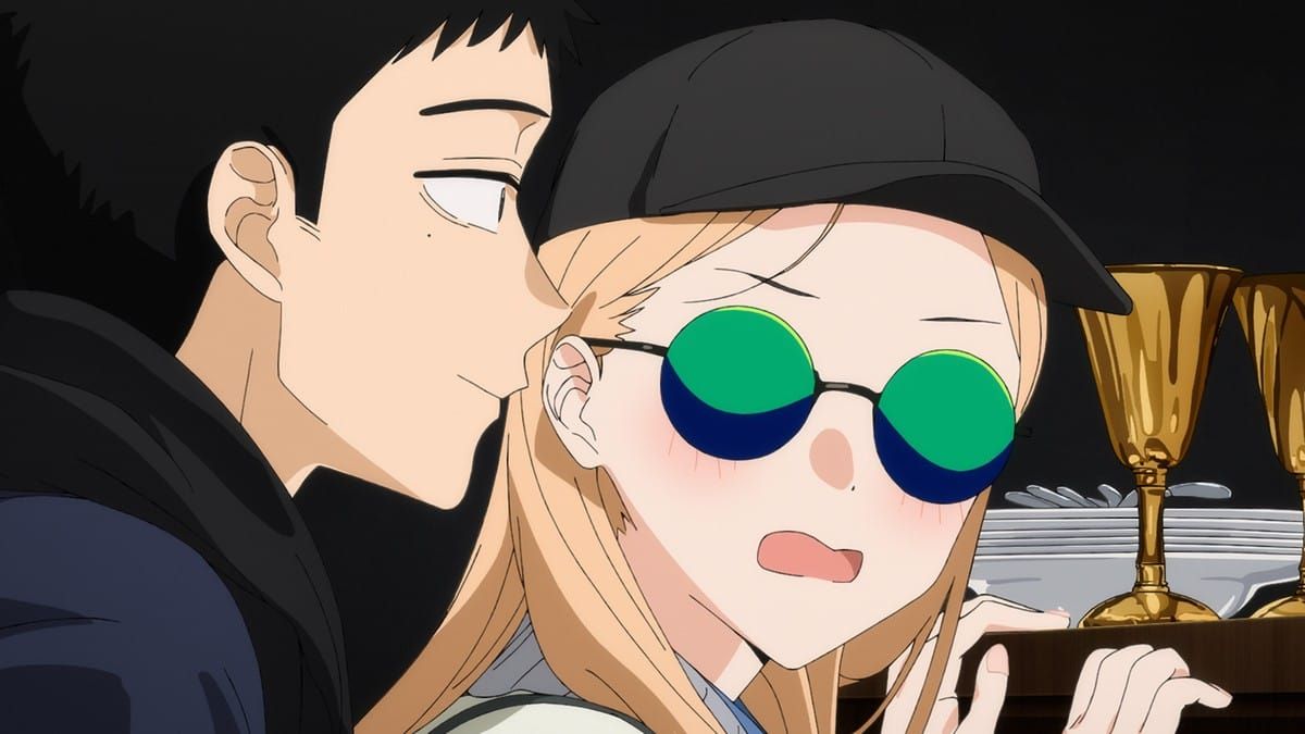 Kitigawa blushes with a scared expression while Gojou stands just behind her with a smile.