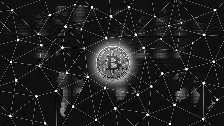 A silver Bitcoin coin glows at the center of a global peer-to-peer node network spanning a dotted world map, white connecting lines on black, illustrating Bitcoin's decentralization.
