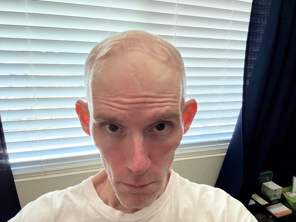 Eric Butow looking at the camera in his home office.