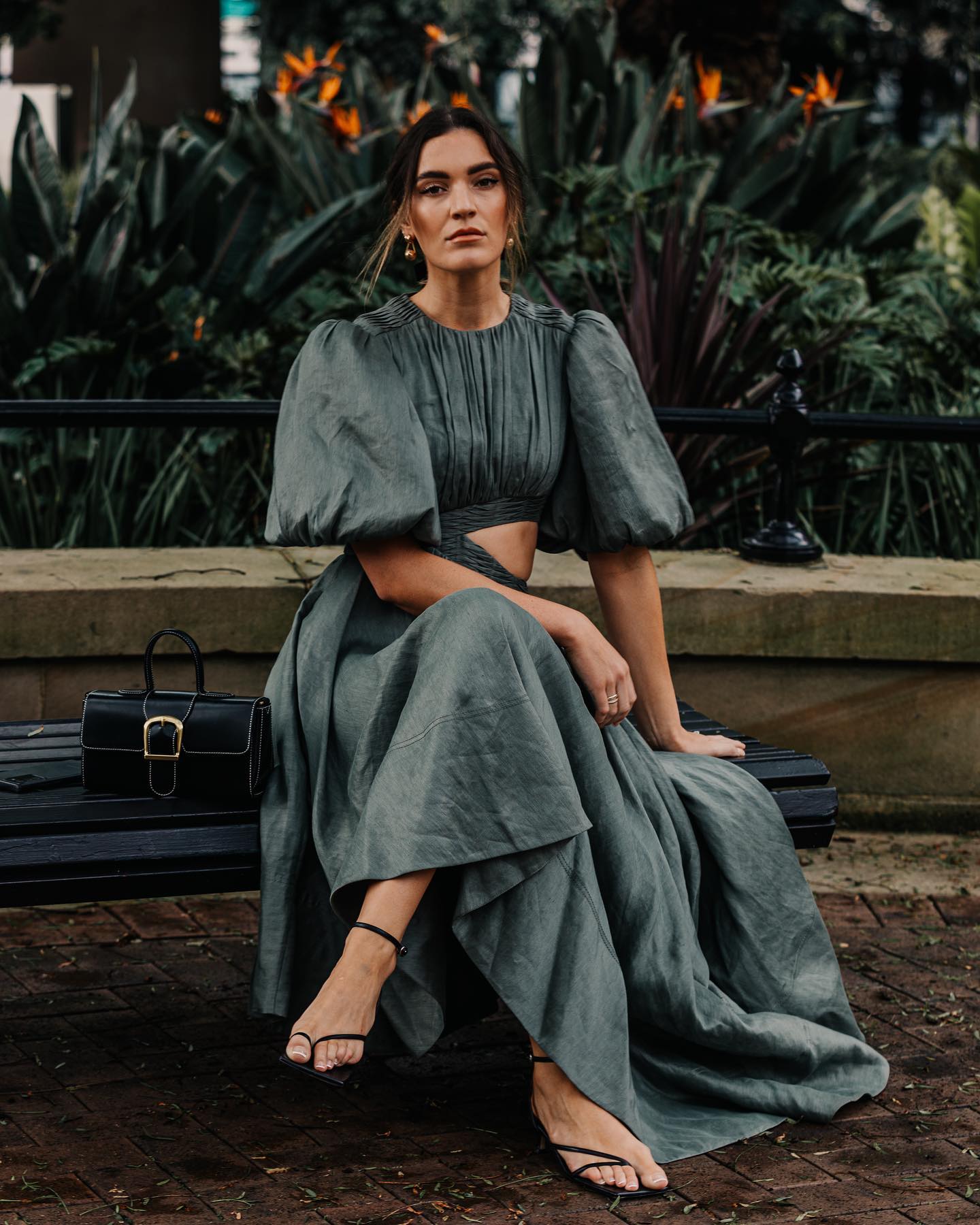 Woman wearing Aje dress outside the Sydney Fashion Week Resort 23 show