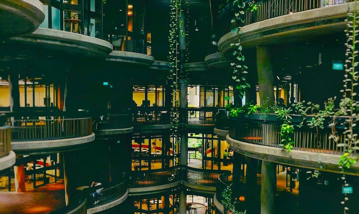 a series of round terraces form the interior of a multi-story building.