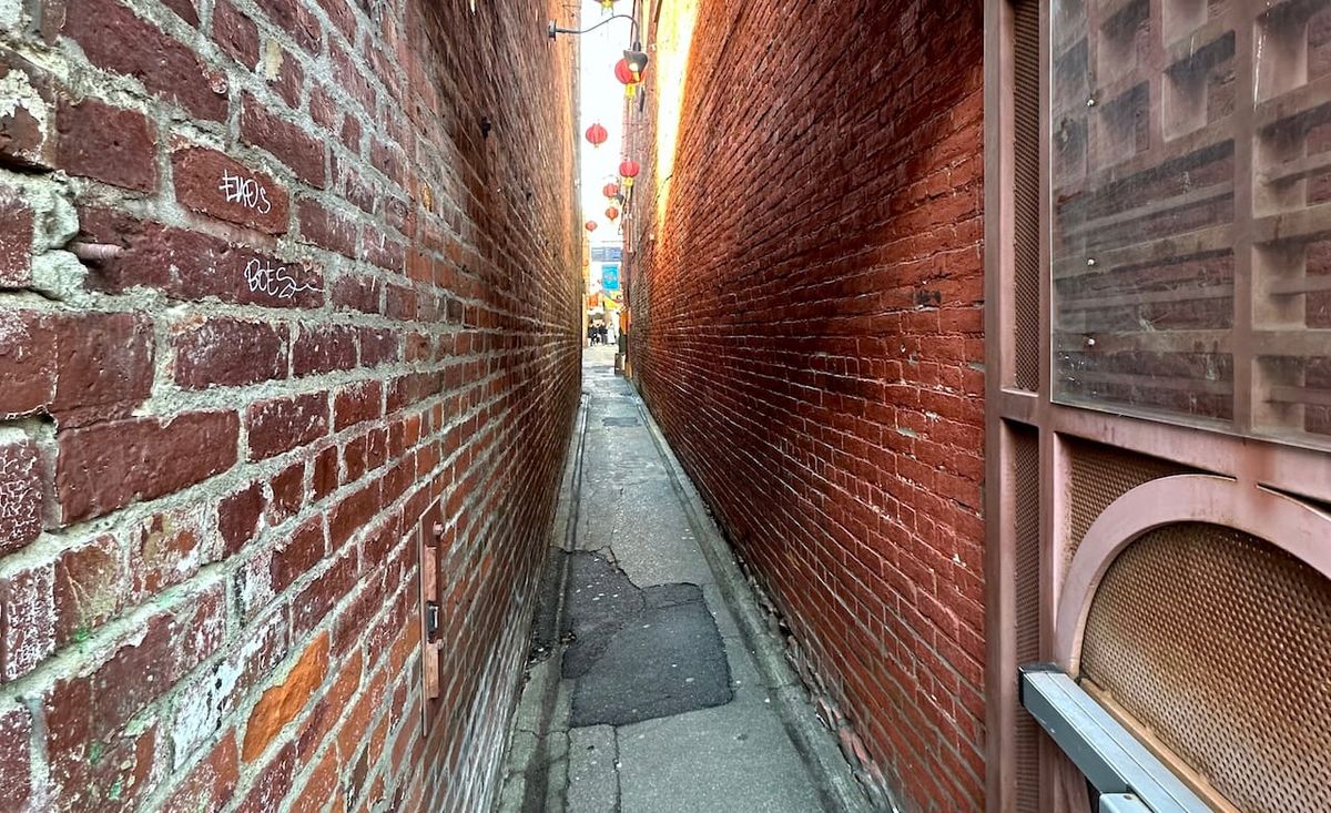 a narrow alley in victoria, b.c.'s fan tan alley.