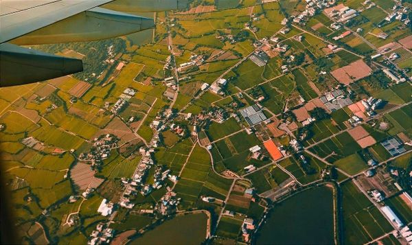 view of a rural area from the window of a plane. 