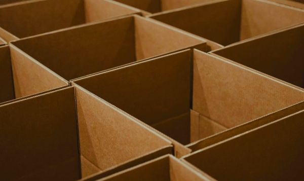 brown cardboard boxes open and arranged in a grid pattern. 
